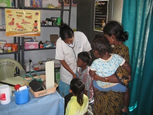 click on image for a larger view Indian slum nurse